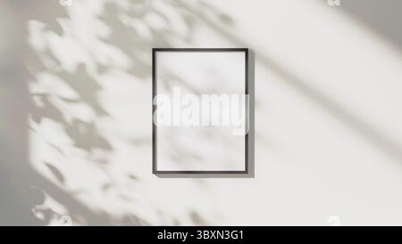 Empty black vertical rectangular frame mock up with leaves shadows and sunlight on white wall background, 3d rendering Stock Photo