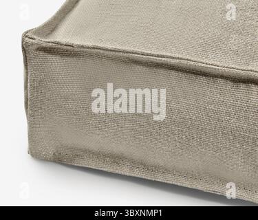 Beige linen fabric with visible texture and stitching creates a natural and inviting feel Stock Photo