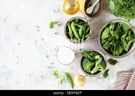 Food, Ingredients for making cream soup of spinach, green peas and broccoli, top view Stock Photo