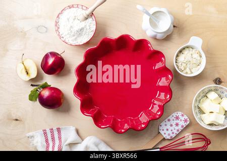 Food, Background for making apple pie. Christmas cake, background for baking a cake with apples, ingredients for making sweet dough, on a wooden backg Stock Photo