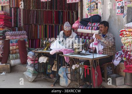 April 4, 2013, Kathmandu, Bagmati Province, Nepal: Two tailors sewing on foot-treadle sewing machines in an outdoor shop in Kathmandu, Nepal. (Credit Image: © Jon G. Fuller/VW Pics via ZUMA Press Wire) Stock Photo