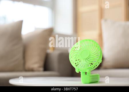 Small electric fan on table Stock Photo