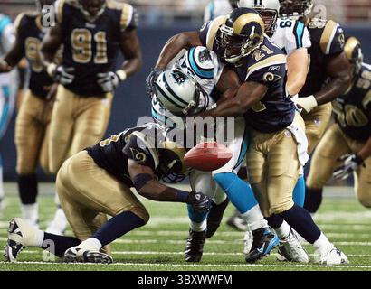 Sept. 9, 2007 - U.S. - Carolina Panthers' DeAngelo Williams fumbles the ball after being hit by St. Louis Rams' Corey Chavous (left) and Oshiomogho Atogwe in the third quarter Sunday, September 9, 2007 at Edward Jones Dome in St. Louis, Missouri. The Carolina Panthers defeated the St. Louis Rams 27-13. (Huy Richard Mach/St. Louis Post-Dispatch/MCT) (Credit Image: © Huy Richard Mach/St Louis Post-Dispatch via ZUMA Press Wire) Stock Photo