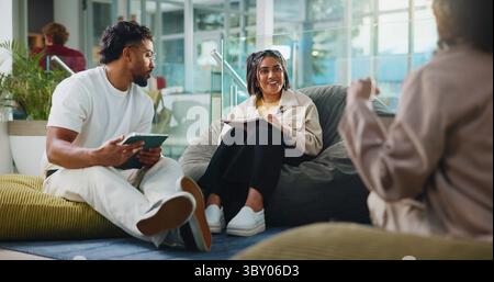 Talking, support and tablet with students in college for test results, study group or education tutor. University friends, scholarship application and Stock Photo