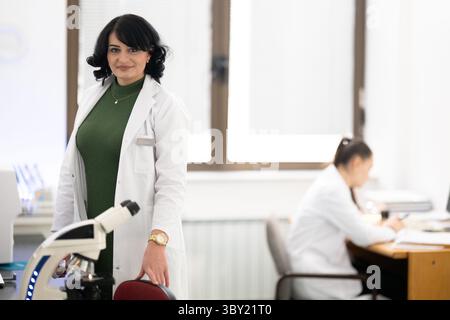 Two female lab technicians working in laboratory Stock Photo