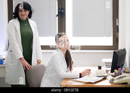 Two female lab technicians working in laboratory Stock Photo