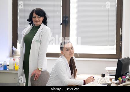 Two female lab technicians working in laboratory Stock Photo