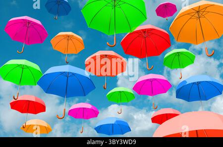 Colored umbrellas flying in the sky. Colored umbrellas flying in the sky. Pink, yellow, green, red, blue, orange umbrellas. 3D illustration img umbrella s02 flying umbrella Stock Photo