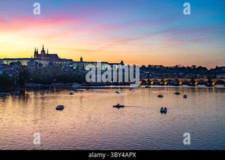 Sunset over the Vltava River, Charles Bridge and Prague Castle in Prague, Czech Republic Stock Photo