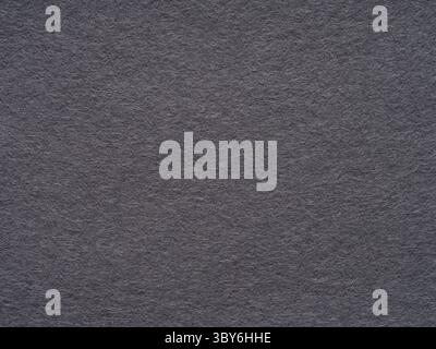 The textured charcoal gray felt. Stock Photo