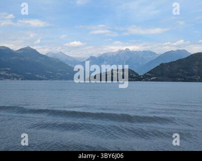 rippling water on lake como with mountains of the north in the background Stock Photo