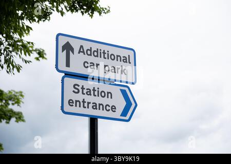 Road traffic direction signs at Salisbury Railway station, additional car parking and station entrance, can be used for concept with letter removal. Stock Photo