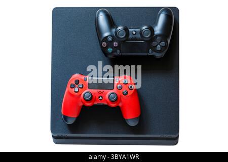 Sony Playstation PS4 controllers DualShock 4 set on PS4 console isolated on white background Stock Photo