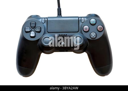 black Sony Playstation PS4 controller DualShock 4 set on white background for video gaming gameplay Stock Photo