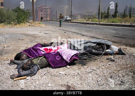 As Suwayda, Syria. 19th July, 2025. Bodies lie on the ground amid clashes between tribal fighters and local Druze factions in southern Syria. Fear and shock grip the province following the escalation of isolated clashes into one of the deadliest outbreaks of violence the region has witnessed in years. Credit: Moawia Atrash/dpa - ATTENTION: graphic content/dpa/Alamy Live News Stock Photo