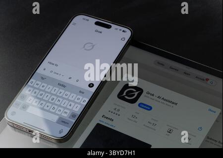 New York, USA - July 18, 2025: Create promt how to in Grok on smartphone screen close up on tablet background Stock Photo