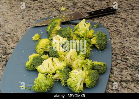 Close-Up of Fresh Broccoli Being Cut Stock Photo