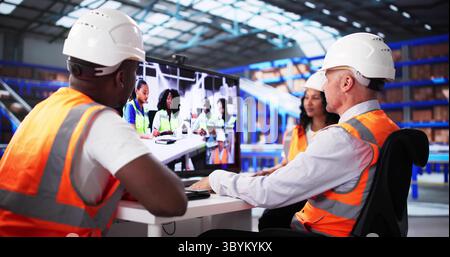 Team Of Diverse Warehouse Operators In Video Webinar On Logistics. Portrait Of Young African-American Woman Working Stock Photo
