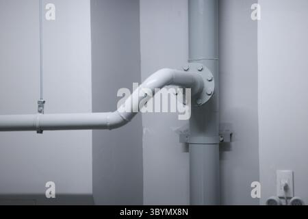 Flanges are connection points to reduce the size of fire protection pipes. Sprinkler fire extinguishing system pipes are reduced in size at the end of Stock Photo