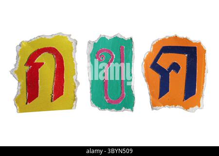 The First Three Thai Alphabet are Gor Gai, Khor Khai and Kor Kwai. Thai letters created from torn colorful magazine paper isolated on white background Stock Photo