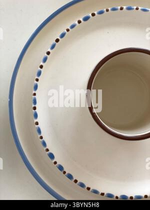 Ceramic donut-shaped tray with brown and blue accents, perfect for serving or as background. Mobile photo Stock Photo