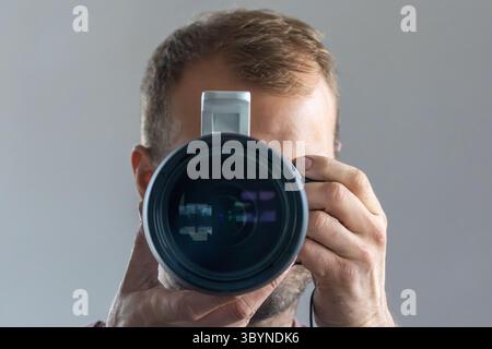 Man taking a photo in a mirror. Stock Photo