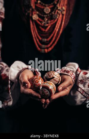 Ukrainian woman hand painted Easter egg. Beautiful geometric slavic decoration Stock Photo