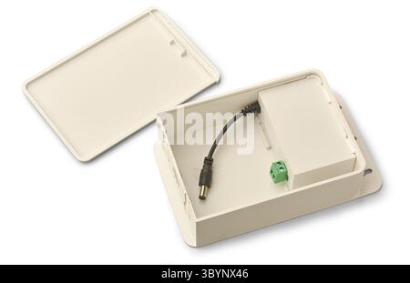 internal components of rectangular power supply unit for cctv camera isolated white background, AC to DC converter for powering security cameras Stock Photo