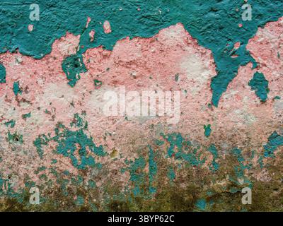 The texture of the peeled weathered paint of an adobe old house, in the town of Sotaquira in the eastern Andean mountains of central Colombia. Stock Photo