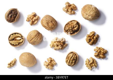 Walnuts (Juglans regia seeds), whole, shelled, halves and partially cracked, top view Stock Photo