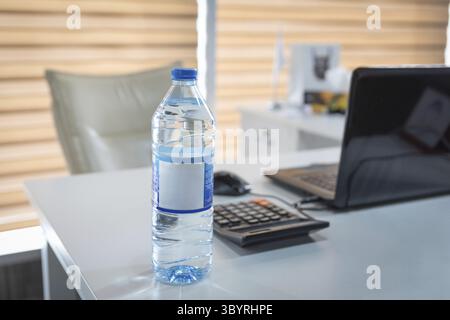 Plastic water bottle on the office desk Stock Photo