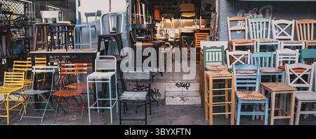 Old colorful chairs in a second hand shop Stock Photo