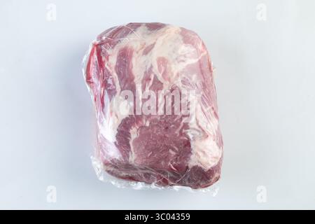Red meat wrapped in plastic isolated nature background with clipping path Stock Photo