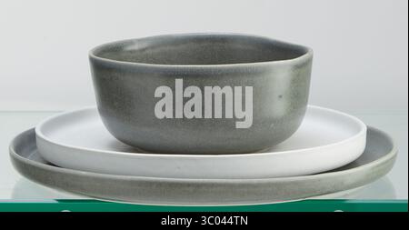 Stacked ceramic plates and cups isolated nature background with clipping path Stock Photo