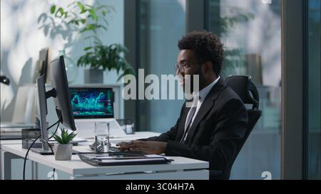 Two people businessmen talking African American employee Caucasian boss leader business working together teamwork discussing project males coworkers Stock Photo