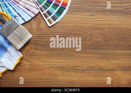 Various painting tools and color palette on wooden background	 Various painting tools and color palette on wooden background Stock Photo