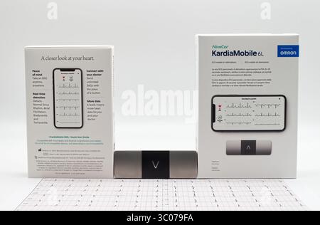 A close-up view of the alivecor kardiamobile 6L by Omron. Personal ekg device and its packaging, showcasing modern he Stock Photo