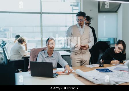 A diverse group of business employees engaging in a collaborative work session within a modern office environment. Stock Photo