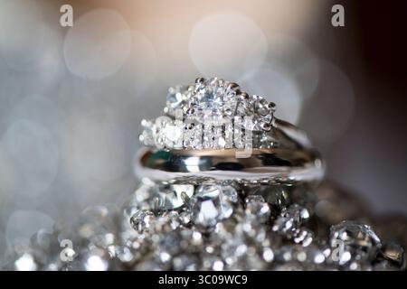 Diamond Engagement and Wedding Rings with Sparkling Bokeh Stock Photo