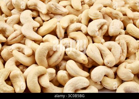 dried roasted unsalted cashew nuts background Stock Photo