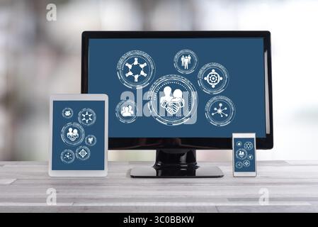 Collaboration concept shown on different information technology devices Stock Photo