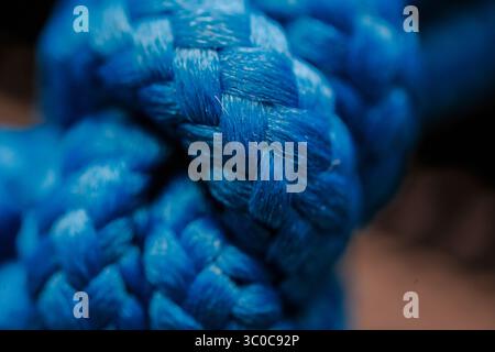 Close up of Vibrant Blue Braided Rope Texture Knot Stock Photo