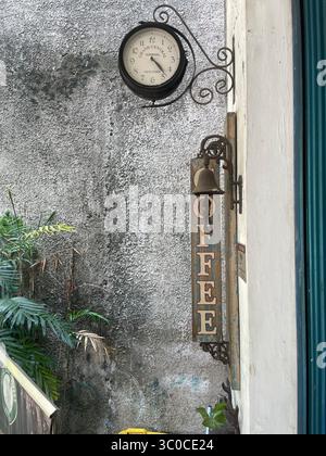 Decorative wall featuring a round vintage-style clock at a cafe in Tangsel Indonesia 19 July 2025. Stock Photo