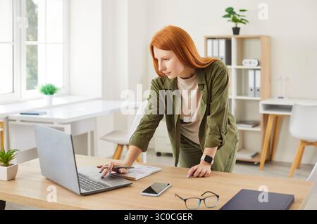 Woman Working Or Studying Online From Her Home Office Stock Photo