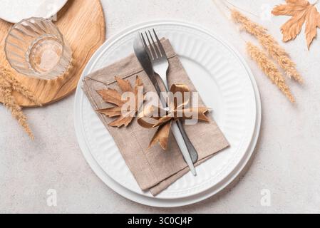 Boho style place setting with dry plants on white background, top view. White aestethic minimal table setting template. Stock Photo