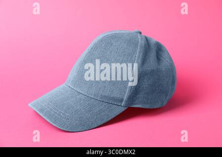 Denim baseball hat on pink background, closeup Stock Photo