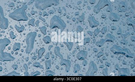 Raindrops on Blue Glitter Car Background Stock Photo