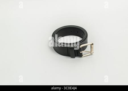 Black belt. Black mans belt isolated on grey background Stock Photo