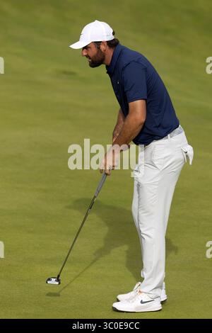 Scottie Scheffler prepares to putt on the 9th green during the first ...