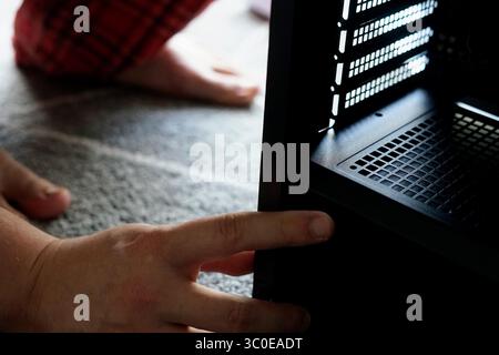 man repairing computer working home looking fixing broken engineer hardware pc service support Stock Photo